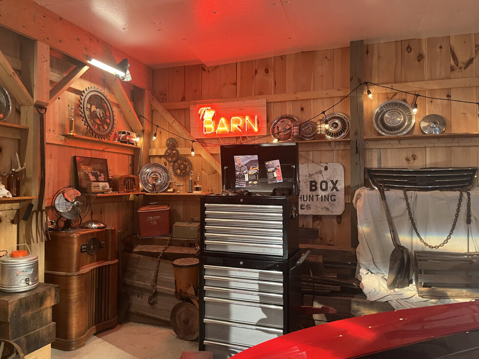Behind-the-scenes view of the WIX Filters TV commercial set, styled like a rustic garage bar with neon “Barn” sign and production lighting visible.